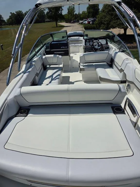 Slide: The Image of 2016 Formula 290 Bowrider with spacious seating and sleek design in a sunny outdoor setting. - 27
