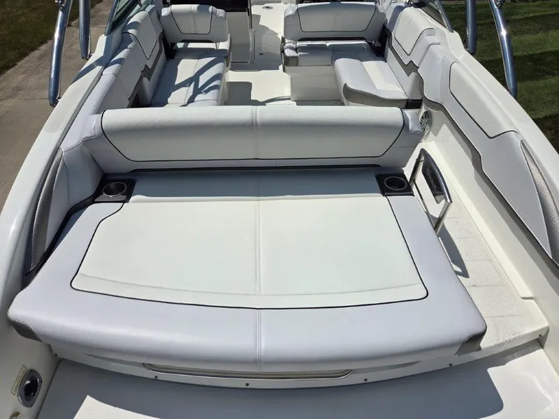 Slide: The Image of 2016 Formula 290 Bowrider interior with white seating and cup holders. - 28