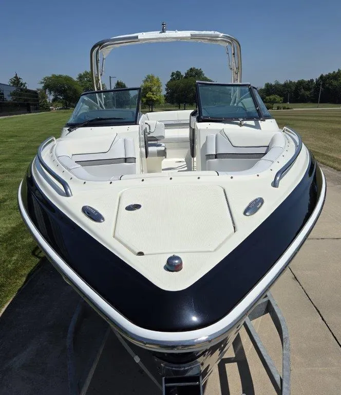Slide: The Image of 2016 Formula 290 Bowrider boat on trailer, featuring sleek design and spacious seating. - 32