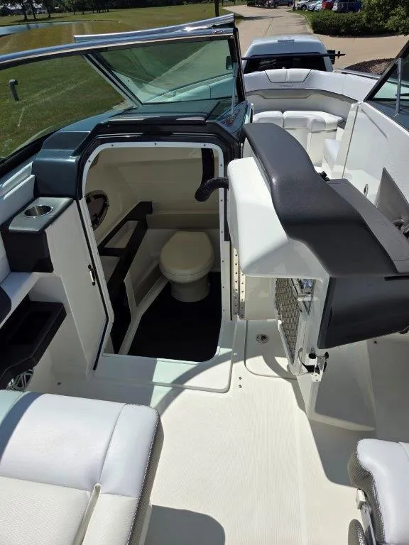 Slide: The Image of 2016 Formula 290 Bowrider interior with seating and compact restroom. - 4