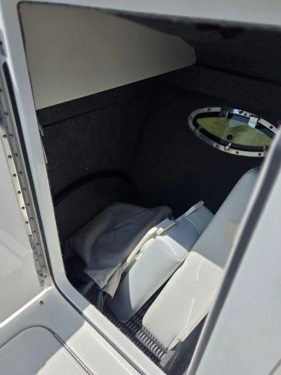 Slide: The Image of Interior cabin of a 2016 Formula 290 Bowrider boat with seating and window. - 6