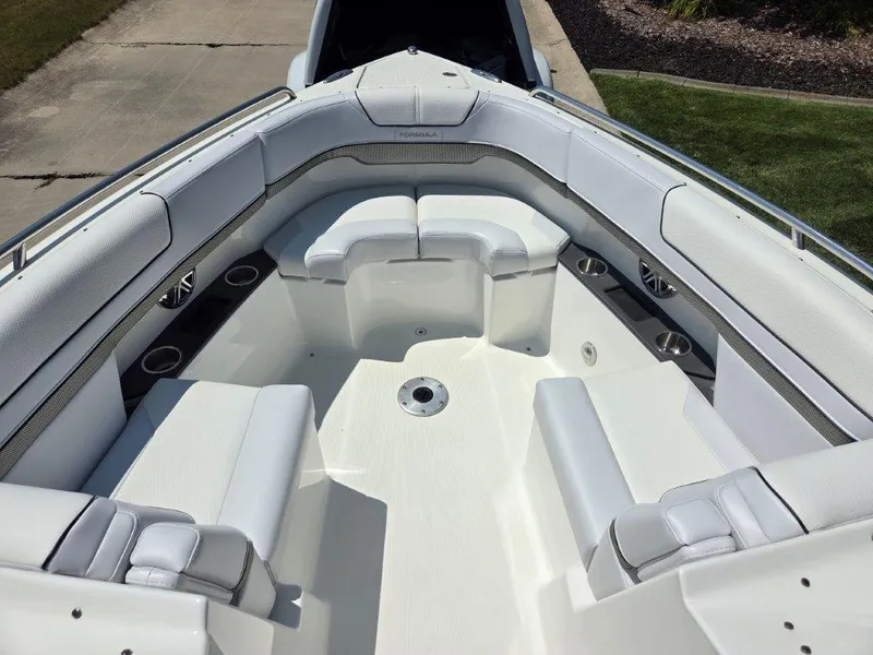 Slide: The Image of 2016 Formula 290 Bowrider boat interior with white seating and cup holders. - 7