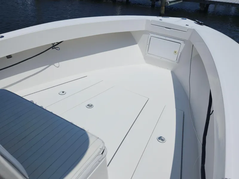 Slide: The Image of 2002 Regulator 23 Classic boat interior with seating and storage compartments. - 15