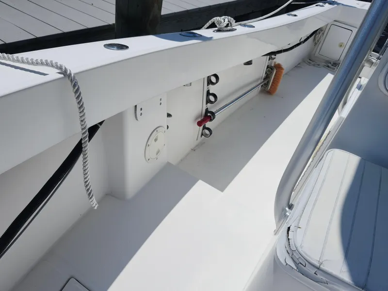 Slide: The Image of 2002 Regulator 23 Classic boat interior with clean white deck and seating. - 18
