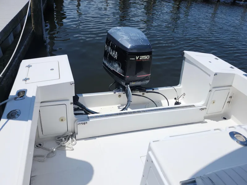 Slide: The Image of 2002 Regulator 23 Classic boat with Yamaha V250 outboard motor at dock. - 21