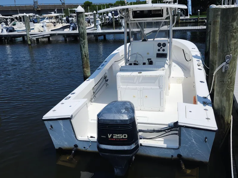 Slide: The Image of 2002 Regulator 23 Classic boat docked with Yamaha V250 outboard engine. - 22