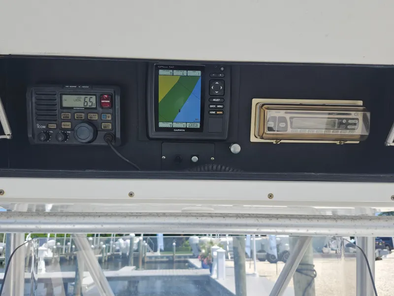 Slide: The Image of 2002 Regulator 23 Classic boat dashboard with radio, GPS, and stereo system. - 27