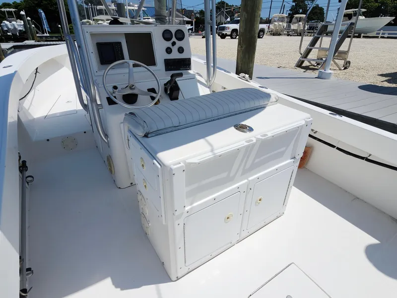 Slide: The Image of 2002 Regulator 23 Classic boat interior with steering console and seating. - 9