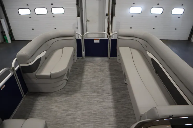 Slide: The Image of 2020 Bennington 16 SL pontoon boat interior with gray seating and flooring. - 11
