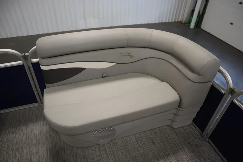 Slide: The Image of 2020 Bennington 16 SL boat interior with curved beige seating. - 12