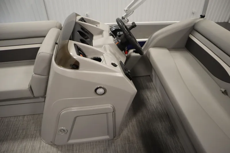Slide: The Image of 2020 Bennington 16 SL boat interior with steering console and seating. - 16