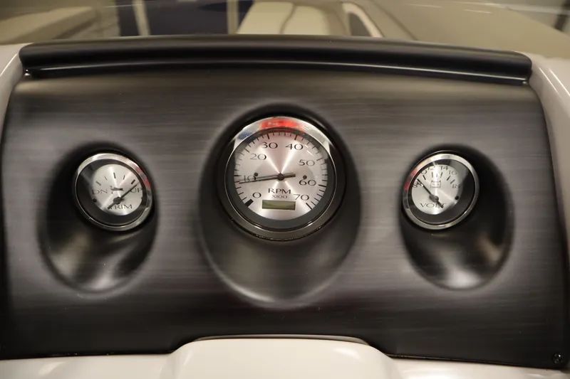 Slide: The Image of Dashboard of a 2020 Bennington 16 SL boat with RPM, trim, and volt gauges. - 20