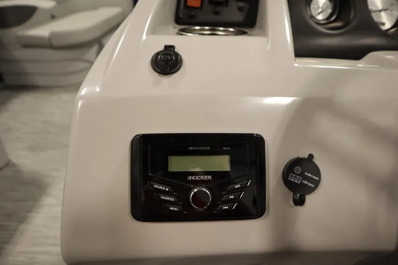 Slide: The Image of 2020 Bennington 16 SL boat dashboard with Kicker media center and USB input. - 22