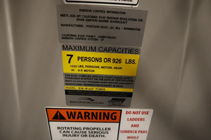 Slide: The Image of Bennington 16 SL 2020 capacity label: 7 persons, 926 lbs, 40 HP motor warning. - 26