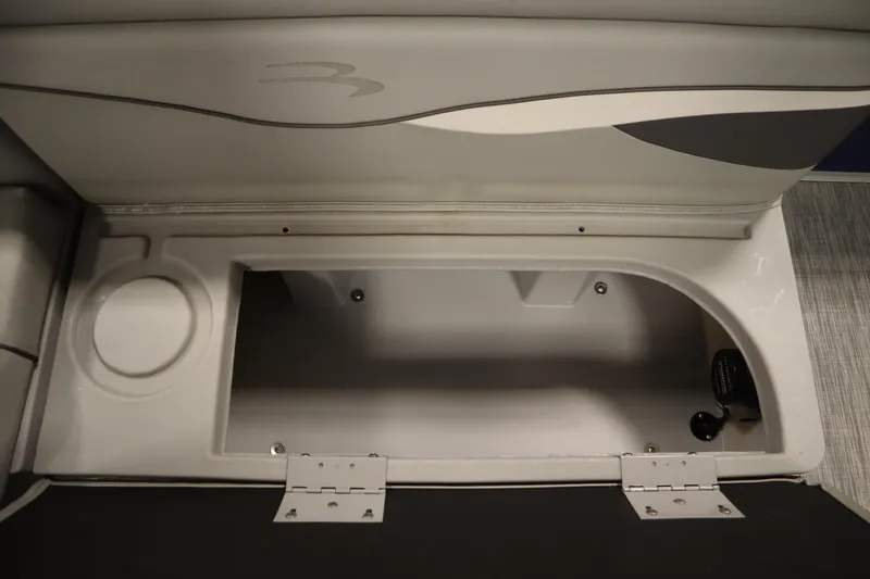 Slide: The Image of Storage compartment in a 2020 Bennington 16 SL boat, featuring cup holder and sleek design. - 28