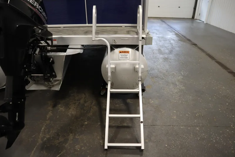 Slide: The Image of Rear view of a 2020 Bennington 16 SL boat with ladder and Mercury engine. - 34