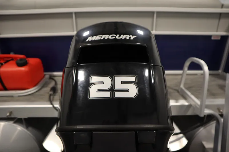 Slide: The Image of Mercury 25 outboard motor on 2020 Bennington 16 SL boat, with red fuel tank nearby. - 38