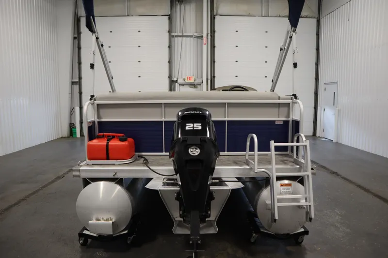 Slide: The Image of 2020 Bennington 16 SL pontoon boat with Mercury 25 engine in a garage. - 6