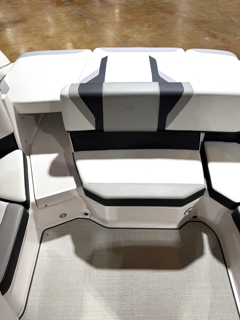 Slide: The Image of 2025 Regal 2000 ES boat interior seating with modern design and white upholstery. - 5