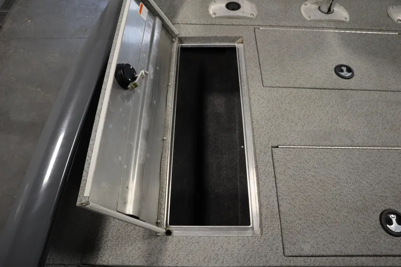 Slide: The Image of Open storage compartment on 2017 Tracker 20 CW Pontoon boat deck. - 18