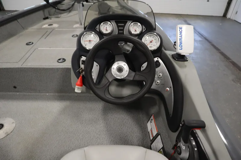 Slide: The Image of 2017 Tracker 20 CW Pontoon boat dashboard with steering wheel and Lowrance device. - 23