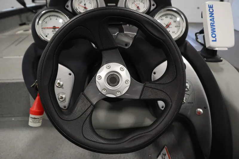 Slide: The Image of Steering wheel and gauges of 2017 Tracker 20 CW Pontoon boat. - 24
