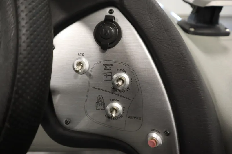 Slide: The Image of Control panel of 2017 Tracker 20 CW Pontoon boat with switches and dials. - 27