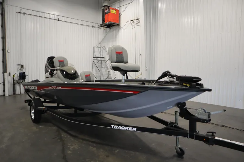 Slide: The Image of 2017 Tracker 20 CW Pontoon boat in a garage setting. - 3