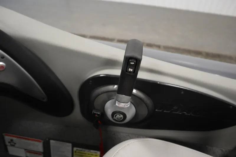 Slide: The Image of Throttle control lever on a 2017 Tracker 20 CW Pontoon boat dashboard. - 30