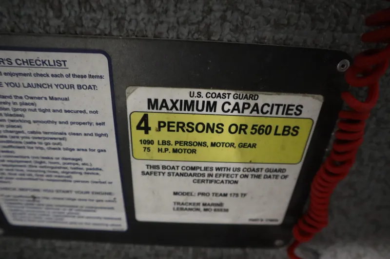 Slide: The Image of 2017 Tracker 20 CW Pontoon capacity label, 4 persons or 560 lbs, U.S. Coast Guard compliant. - 31