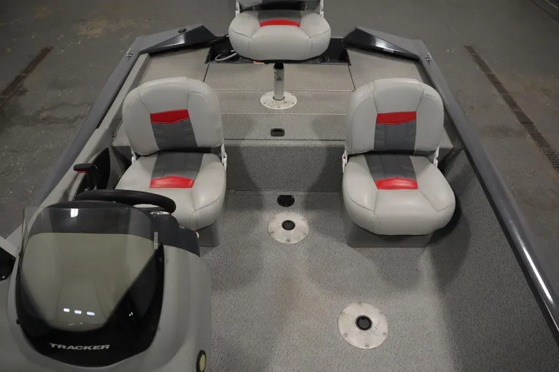 Slide: The Image of 2017 Tracker 20 CW Pontoon boat interior with three gray and red seats. - 32
