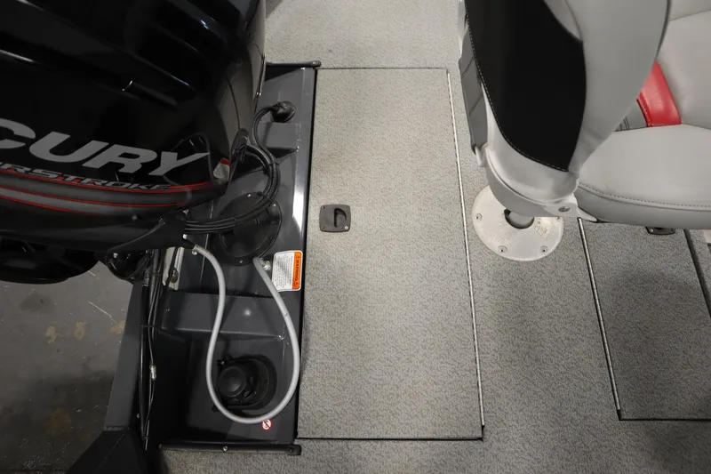 Slide: The Image of 2017 Tracker 20 CW Pontoon boat interior with Mercury engine and seating. - 41