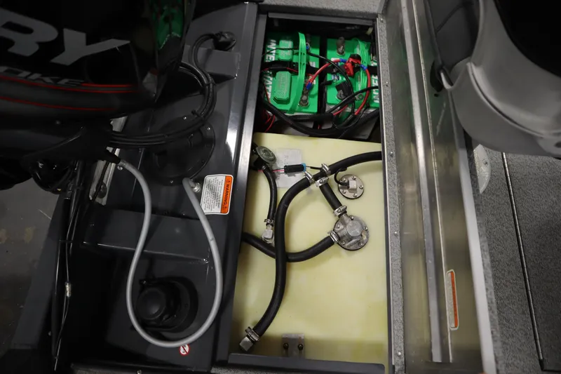 Slide: The Image of 2017 Tracker 20 CW Pontoon boat engine compartment with battery and wiring. - 42