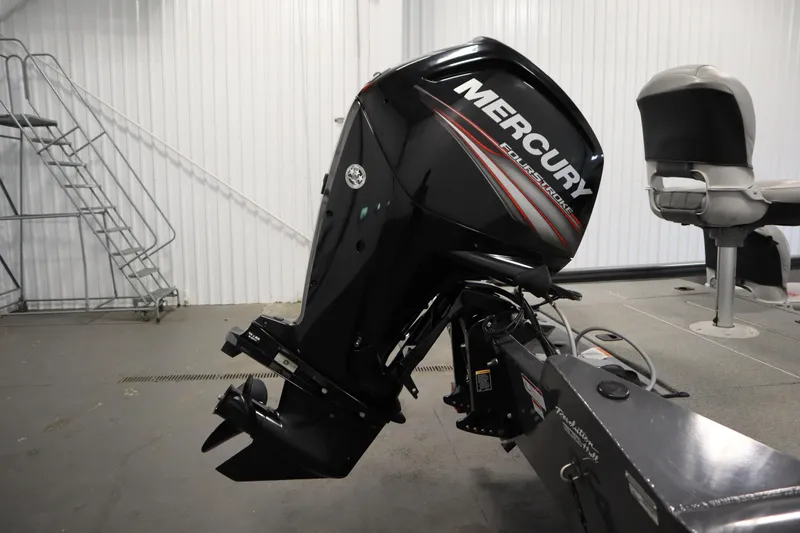 Slide: The Image of 2017 Tracker 20 CW Pontoon with Mercury FourStroke outboard motor in a garage setting. - 44