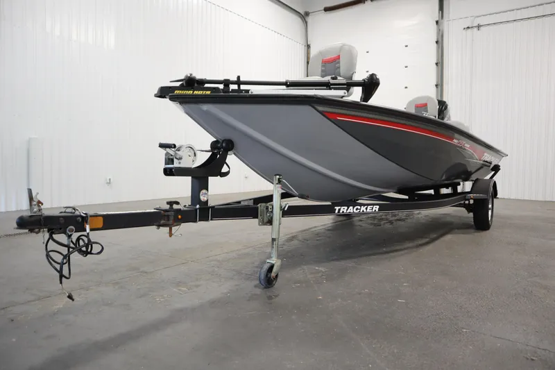 Slide: The Image of 2017 Tracker 20 CW Pontoon boat on trailer in indoor storage. - 47