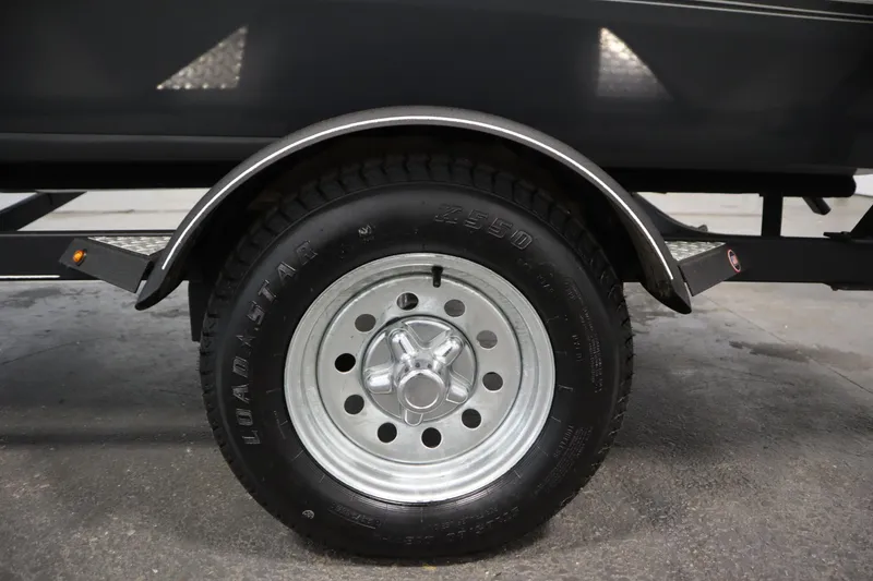 Slide: The Image of Trailer wheel of 2017 Tracker 20 CW Pontoon, featuring Loadstar tire. - 48