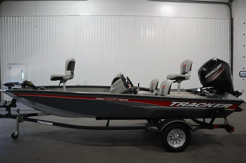 Slide: The Image of 2017 Tracker 20 CW Pontoon boat with Mercury engine, parked indoors on trailer. - 8