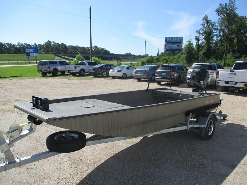 Slide: The Image of 2025 Gator Tail 1754 Extreme boat on trailer in parking lot, sunny day. - 2