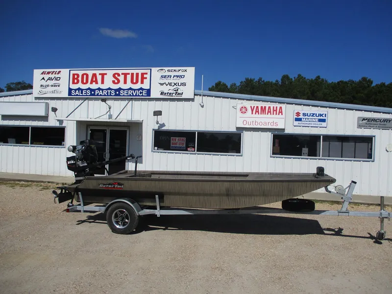 Slide: The Image of 2025 Gator Tail 1754 Extreme boat on trailer outside dealership. - 3