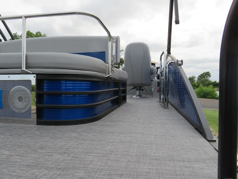 Slide: The Image of 2024 Bennington 25 LTSB pontoon boat interior with modern seating and sleek design. - 5