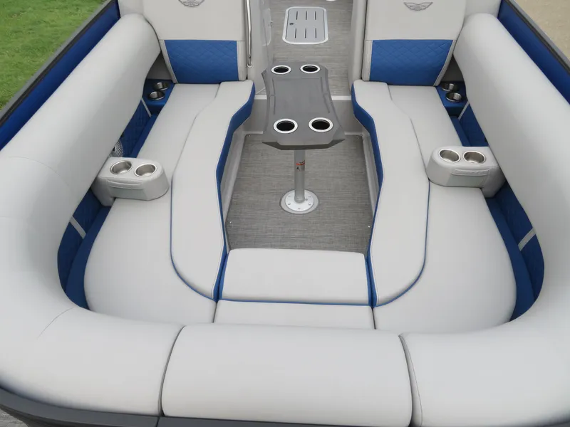 Slide: The Image of 2024 Bennington 25 LTSB boat interior with plush seating and cup holders. - 8