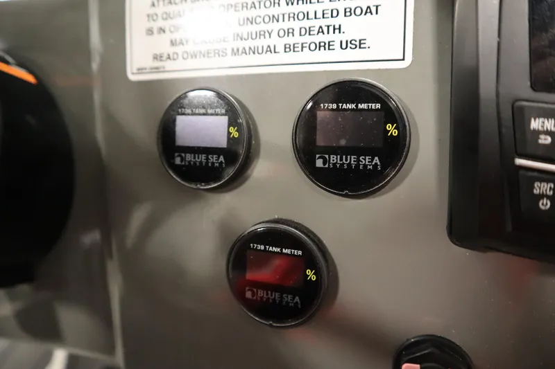 Slide: The Image of Control panel of 2023 Heyday WT Surf boat with Blue Sea Systems tank meters. - 24