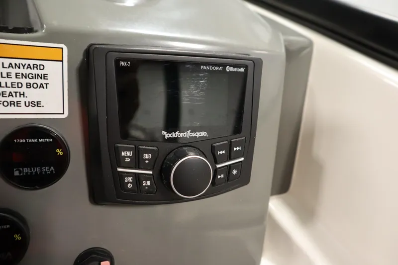 Slide: The Image of 2023 Heyday WT Surf boat dashboard with Rockford Fosgate audio system and control panel. - 25