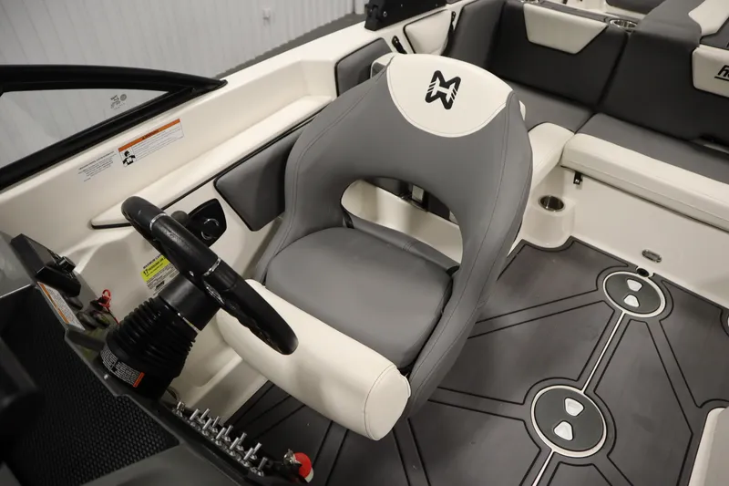 Slide: The Image of 2023 Heyday WT Surf boat interior with steering wheel and seating. - 27