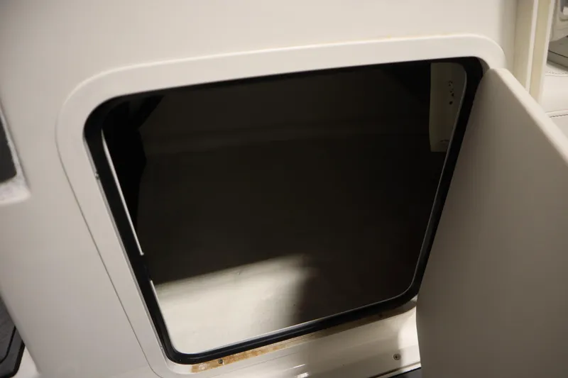 Slide: The Image of Open storage compartment on 2023 Heyday WT Surf boat. - 30