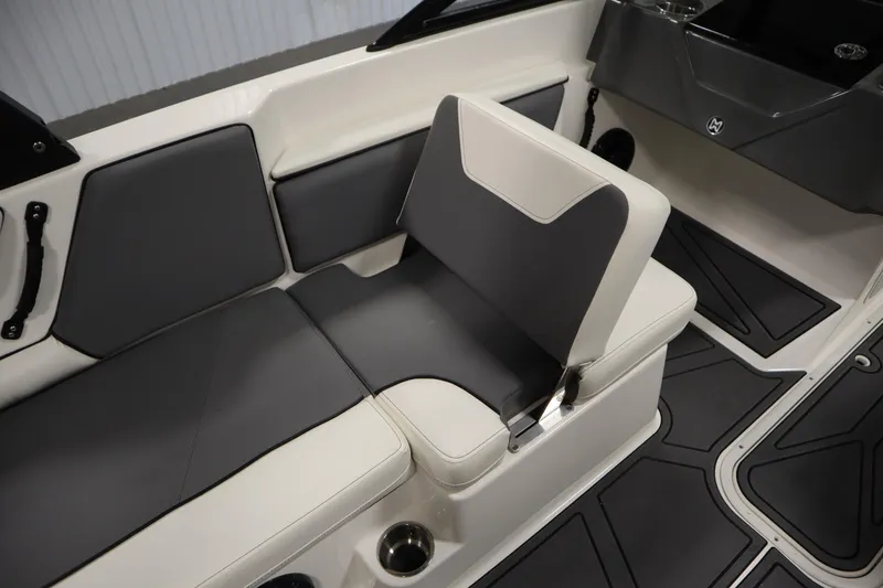 Slide: The Image of 2023 Heyday WT Surf boat interior with gray and white seating and cup holders. - 36