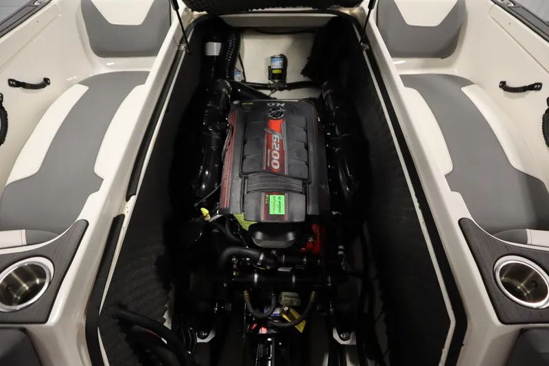 Slide: The Image of 2023 Heyday WT Surf boat engine compartment with seating and cup holders. - 41