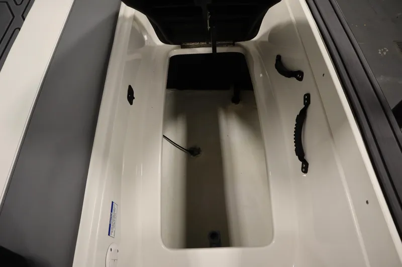 Slide: The Image of 2023 Heyday WT Surf boat interior storage compartment with handles and cable. - 49