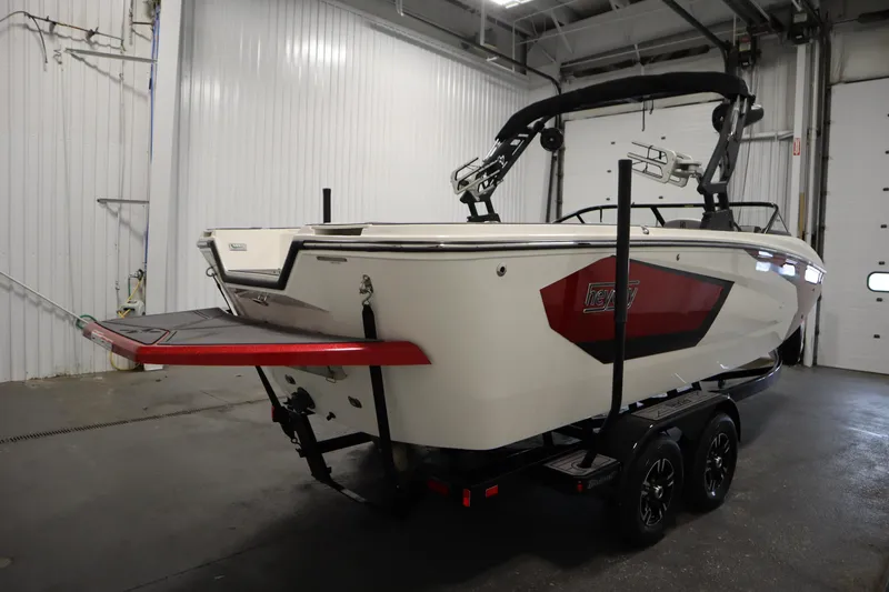 Slide: The Image of 2023 Heyday WT Surf boat on trailer in indoor storage facility. - 5