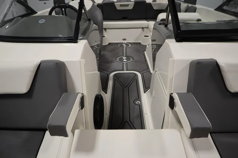 Slide: The Image of 2023 Heyday WT Surf boat interior with gray and white seating and modern design. - 13